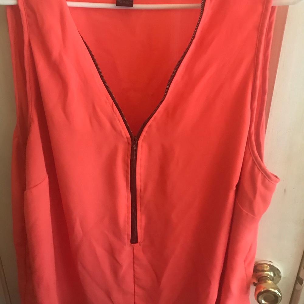 Neon pink sleeveless shirt.